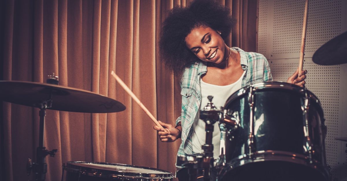 girl playing drums