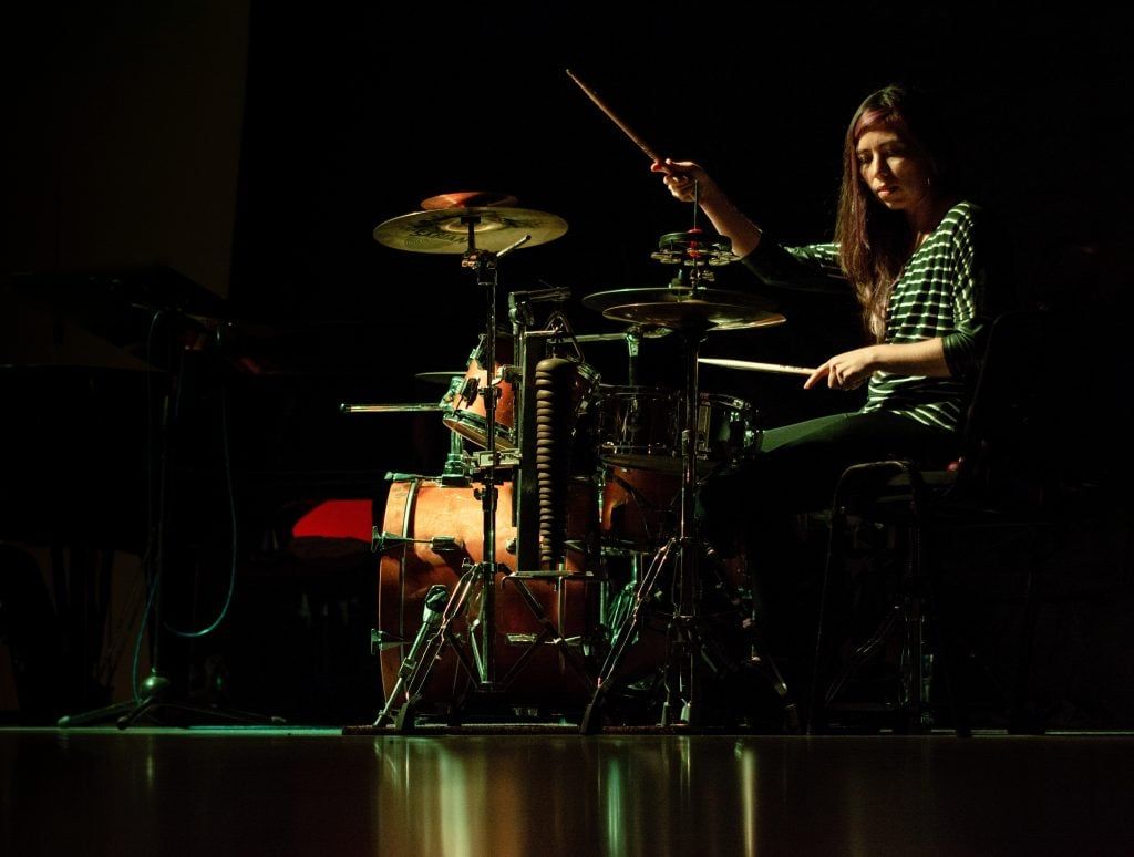 girl playing drums